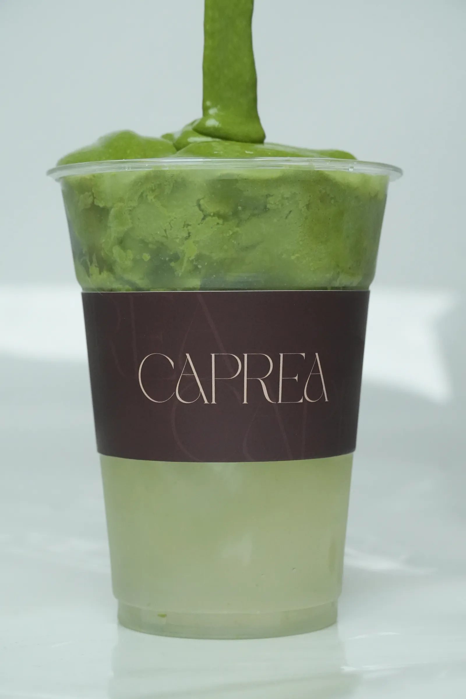 Cloudy matcha being poured